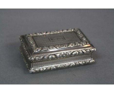 A GEORGE IV NATHANIEL MILLS SILVER RECTANGULAR SNUFF BOX, scroll and floral casting, engine turned and engraved initials, gil
