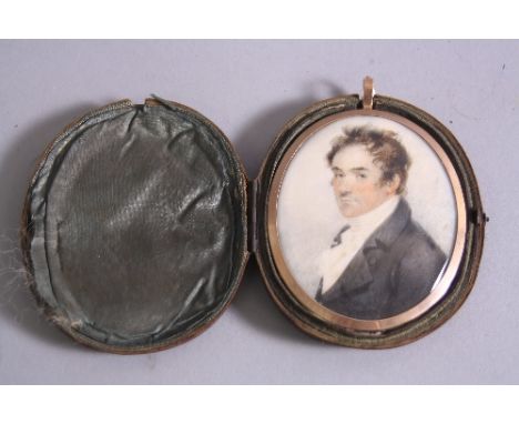 BRITISH SCHOOL (EARLY 19TH CENTURY), portrait miniature of gentleman, head and shoulders, wearing a blue jacket, within a yel