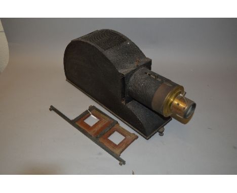 A MAGIC LANTERN, constructed from pressed steel and brass, with a double plate carriage, the body has textured paint finish a