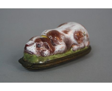 A LATE 18TH CENTURY ENAMEL SNUFF BOX, in the form of a recumbant Spaniel, yellow collar, brown fur, the hinged cover painted 
