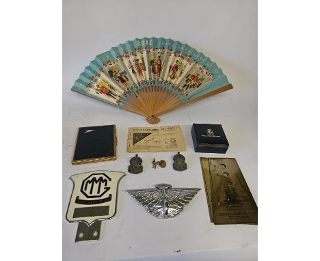 A collection of vintage car badges, BOAC case, fuel ration book and other items. 