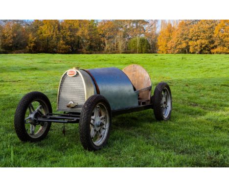 AMENDED DESCRIPTION: 20th Century soapbox car with 'Bugatti' name plate, with Leather steering Wheel, wooden and metal frame 