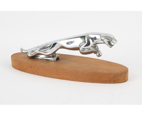 Jaguar - 'Leaping Cat' Car Mascot, mounted on a oval wooden base, Chrome plated, Length 23cm. 