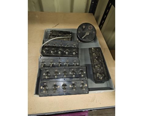 Eight vintage car switch units along with other small vintage car dials. 