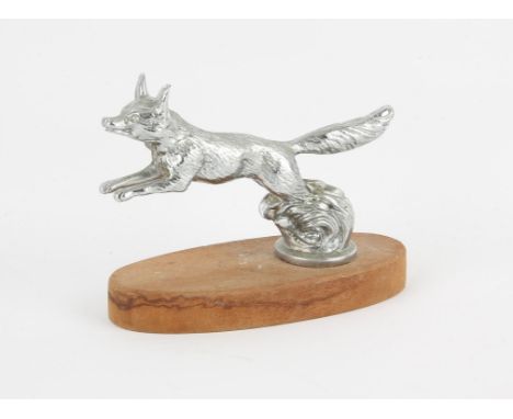 Silver plated 'leaping fox' Car Mascot, Mounted on a wooden base (12cm High with a base of 15cm long). 