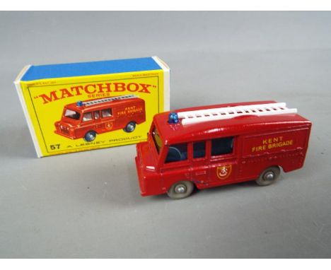 Matchbox by Lesney - Land Rover Fire Truck, red body, grey plastic wheels, rounded axles # 57, mint in mint original box - a 