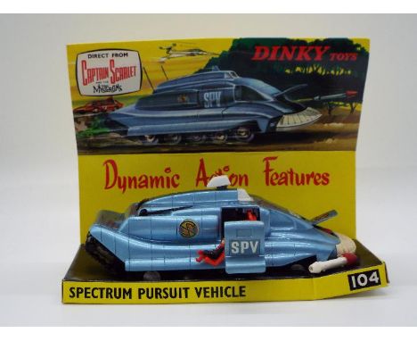 Dinky Toys - A boxed Dinky Toys 'Captain Scarlet' #104 Spectrum Pursuit Vehicle.Finished in blue with characteristic white bu