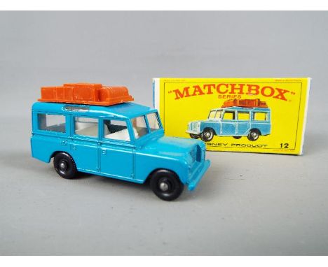 Matchbox by Lesney - Land Rover safari, blue body, black plastic wheels with rounded axles # 12, mint in original box 