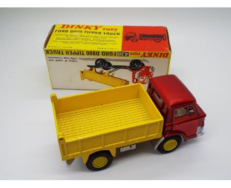 Dinky Toys - A boxed Dinky Toys #438 Ford D800 Tipper Truck. The model with metallic red cab, white interior, yellow hubs and