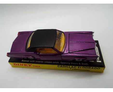 Dinky Toys - A boxed Dinky Toys #175 Cadillac Eldorado. The model in metallic purple with yellow interior, and black roof wit