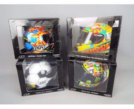 Minichamps - four Valentino Rossi 1:2 scale diecast Racing Helmets, AGV MotoGP all different, all appear mint in window boxes
