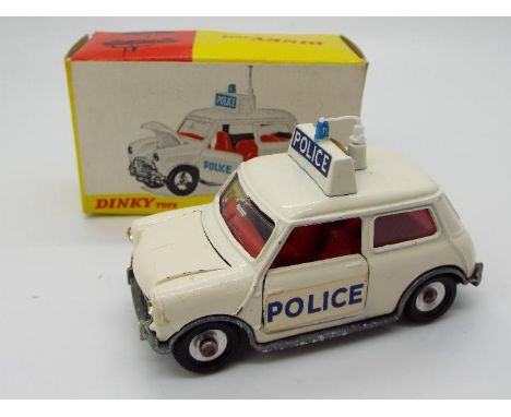 Dinky Toys - A boxed Dinky Toys #250 Police Mini Cooper. Finished in Off-White with spuns hubs, a roof box with blue light an