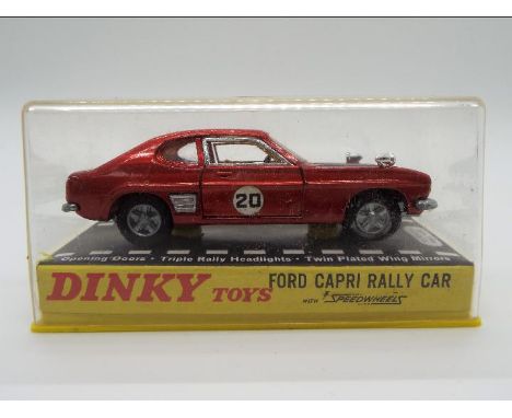 Dinky Toys - A boxed Dinky Toys #213 Ford Capri Rally Car. The model is in metallic red, with black bonnet, yellow interior a