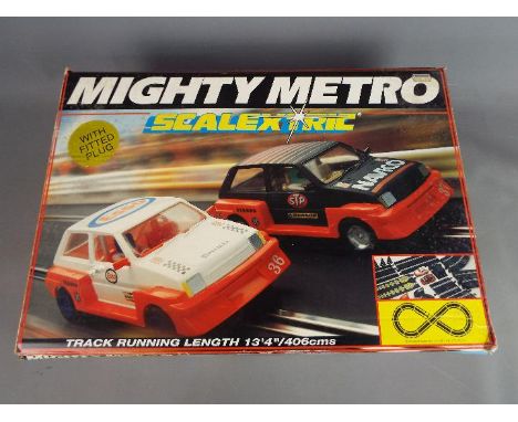 Scalextric - a boxed Scalextric mighty mini set. The set contains two racing minis, controllers, track and power unit. The se