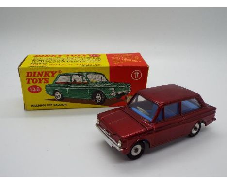 Dinky Toys - A boxed Dinky Toys #138 Hillman Imp Saloon. The model in metallic red with blue interior and chrome spun hubs ap