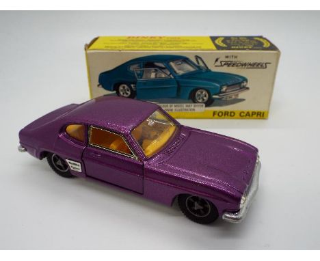 Dinky Toys - A boxed Dinky Toys #165 Ford Capri. This is the purple bodied version of this popular model, with yellow interio