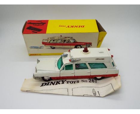 Dinky Toys - A boxed Dinky Toys #267 Superior Cadillac Ambulance. Finished in white and red and with red roof light and spun 