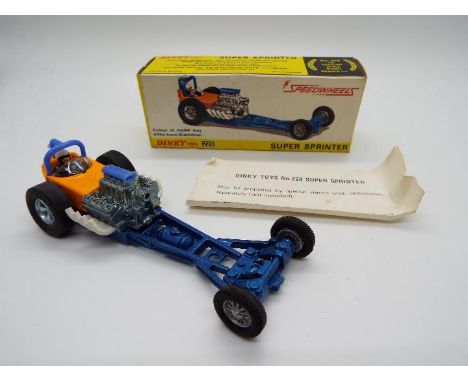 Dinky Toys - A boxed Dinky Toys #228 Super Sprinter Speedwheels. Finished in orange and blue the model appears to be in Mint 