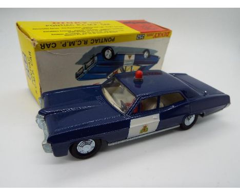 Dinky Toys - A boxed Dinky Toys #252 Pontiac RCMP Car. Finished in blue with grey interior and red roof light, with cast hubs