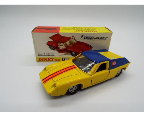 Dinky Toys - A boxed Dinky Toys #218 Lotus Europa. The model has a yellow body, blue roof, black interior with fluorescent or