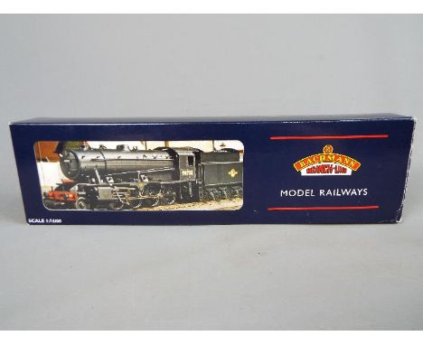 Bachmann - an OO gauge locomotive and tender BR black livery op no 90733, late crest issued in a limited edition WD Austerity