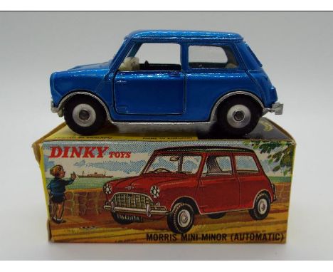 Dinky Toys - A boxed Dinky Toys #183 Morris Mini Minor. This model is in metallic blue with a white interior and has chrome s