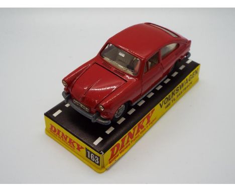 Dinky Toys - A boxed Dinky Toys #163 Volkswagen 1600 TL Fastback. The model in red, with white interior and cast hubs appears