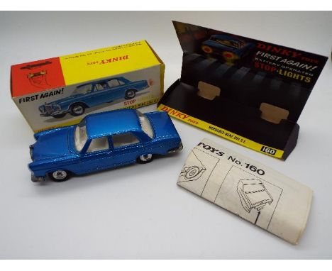 Dinky Toys - A boxed Dinky Toys #160 Mercedes Benz 250 SE. This battery operated model is in blue with a white interior, and 