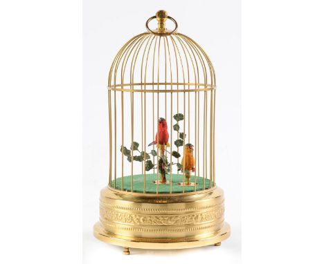 A Swiss clockwork singing bird in a cage automaton, late 20th c ,&nbsp; the cage of lacquered brass, 25cm h excluding ring  G