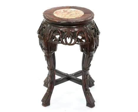 A Chinese hardwood stand, first half 20th c, with marble inset top and carved with bamboo, 48cm h, top 27cm diam  Good condit