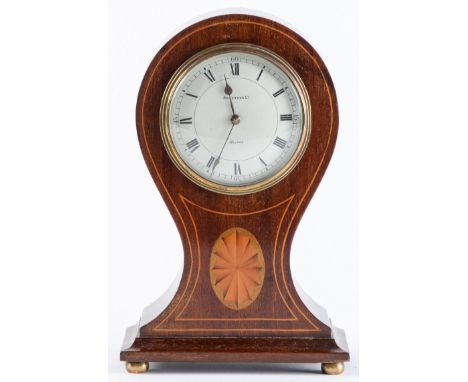 An Edwardian inlaid mahogany balloon shaped mantel clock, c1910, the waisted case with oval, on spreading base and lacquered 