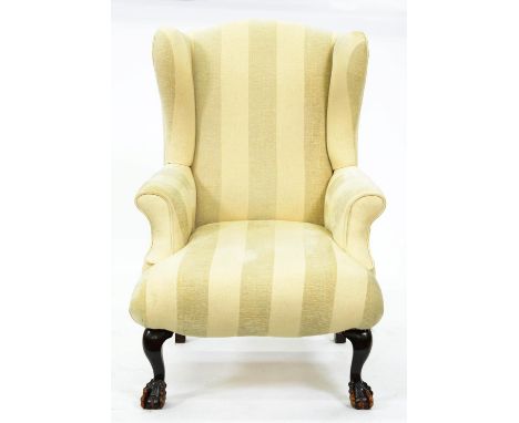 A wing armchair, first half 20th c, in George II style, on cabriole forelegs with claw and ball feet, seat height 40cm  Uphol