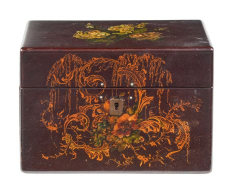 A Victorian papier mache stationery box, Jennens and Bettridge, painted with flowers on a brown ground, silk lined and fitted