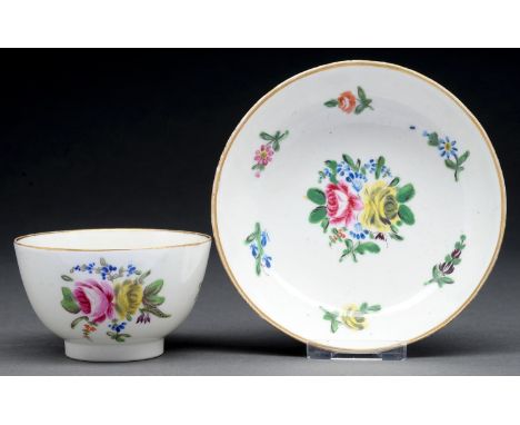 A Caughley polychrome tea bowl and saucer, c1790-95, enamelled with the Back-to-Back Roses pattern, saucer 12cm diam  Light w