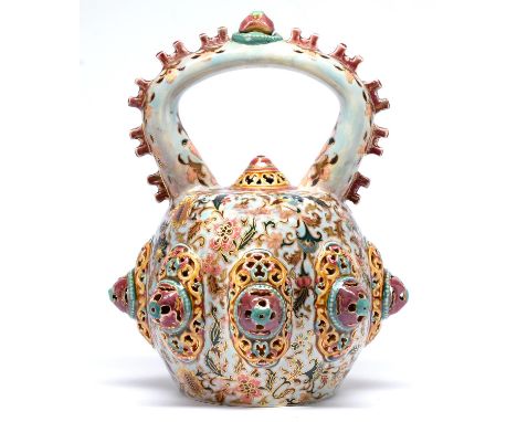 A Zsolnay reticulated and arch handled vessel and stopper, late 19th c, applied with turquoise, ochre and crimson bosses and 