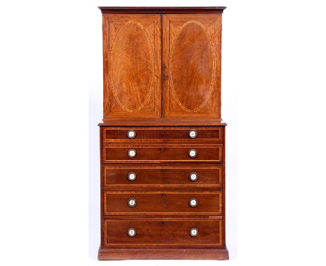 A George III mahogany secretaire chest, with finely figured crossbanded and line inlaid drawer fronts, each with pair of cont