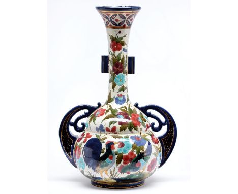 An earthenware vase, in the manner of Zsolnay, late 19th c,&nbsp;of bulbous form with tall flared neck and scroll pierced fla