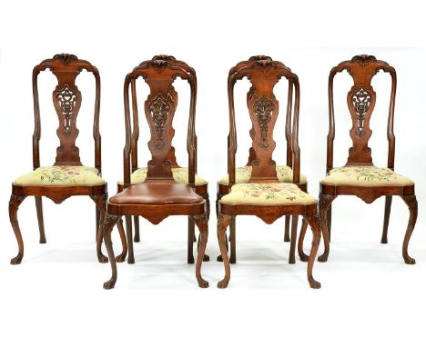 A set of six carved oak dining chairs, first half 20th c,&nbsp; in George I style, the moulded spoon back with crisply carved