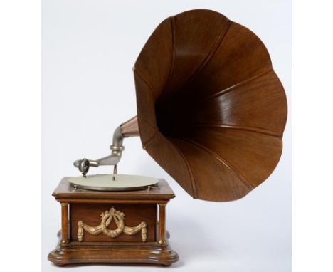 An oak and beech table top gramophone, early 20th c, the square cabinet with brass capped corner pillars, the top with green 