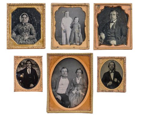 Victorian photographs. Four daguerreotypes&nbsp; of a couple, separately and together and two children, giltmetal mounts, 110