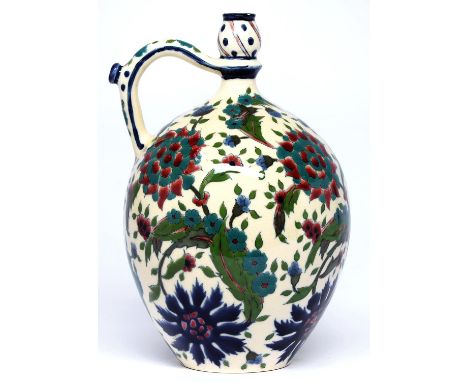 A Zsolnay flask, late 19th c, with pinched neck and spouted handle, with Iznik style floral decoration, 27cm h, impressed and