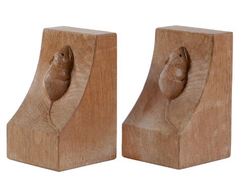 A pair of Robert 'Mouseman' Thompson oak bookends,&nbsp;of adzed, wedge shape with carved mouse 'signature', 15cm h  Both in 