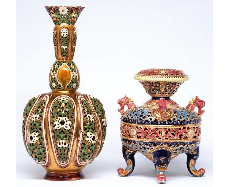 A Zsolnay gilt ground double walled, reticulated vase and a Zsolnay reticulated four footed vase, both late 19th c, one decor