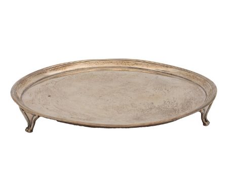 A George III silver salver, with reeded rim, on three feet, the underside later engraved, 25.5cm diam, by Elizabeth Jones, Lo