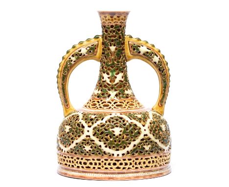 A Zsolnay vase, late 19th c, of double walled, reticulated mallet form and decorated predominantly in green and ochre heighte