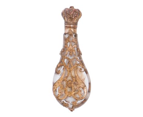 A French engraved gilt brass and glass cagework scent bottle, mid 19th c, flask shaped with embossed cap, stopper, 105mm h  G