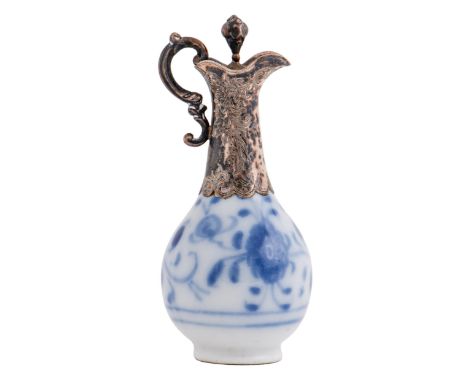 A Continental silver mounted blue and white porcelain scent flask and stopper, 19th c, of ewer shape, 92mm h, underglaze blue