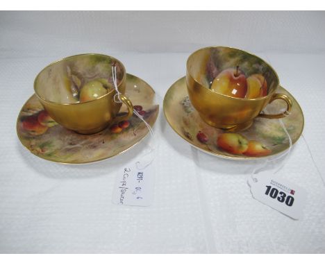 Two Royal Worcester Tea Cups and Saucers, painted by Ricketts, signed, with ripening fruit on mossy woodland banks, the sauce