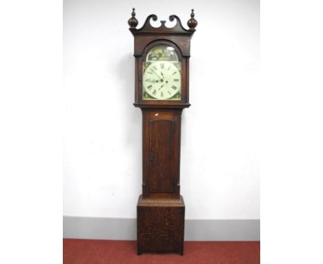 An Early XIX Century Oak and Mahogany 8-Day Longcase Clock, with swan neck pediment, turned finials and arched door, the whit