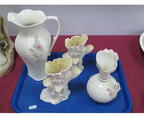 A Modern Belleek Porcelain Shaped Ewer, with moulded decoration, printed mark, 26.5cm high; Two Similar Vases, 7cm and 18cm h